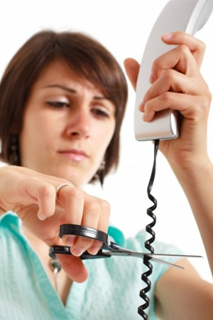 stressed_woman_cutting_telephone_cable.jpg